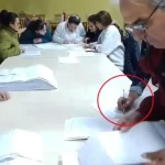 Във видео се вижда как член на СИК попълва бюлетини