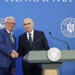Румънският премиер Илие Боложан и главният изпълнителен директор на "Райнметал" Армин Папергер