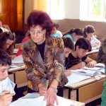 учители