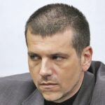 Главният секретар на МВР Калин Георгиев гледа под вежди младшите криминални разузнавачи.